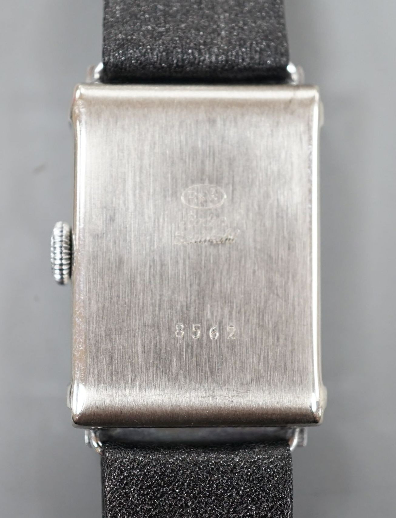 A gentleman's steel Record Watch Co, manual wind wrist watch, on associated leather strap.